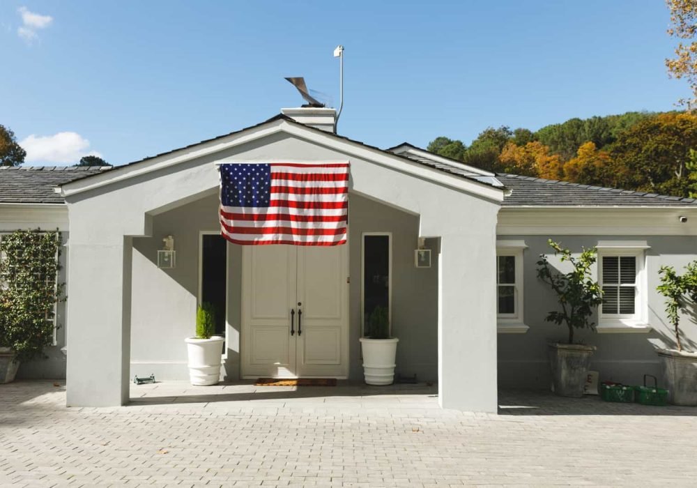 American flag at building entrance for construction project.