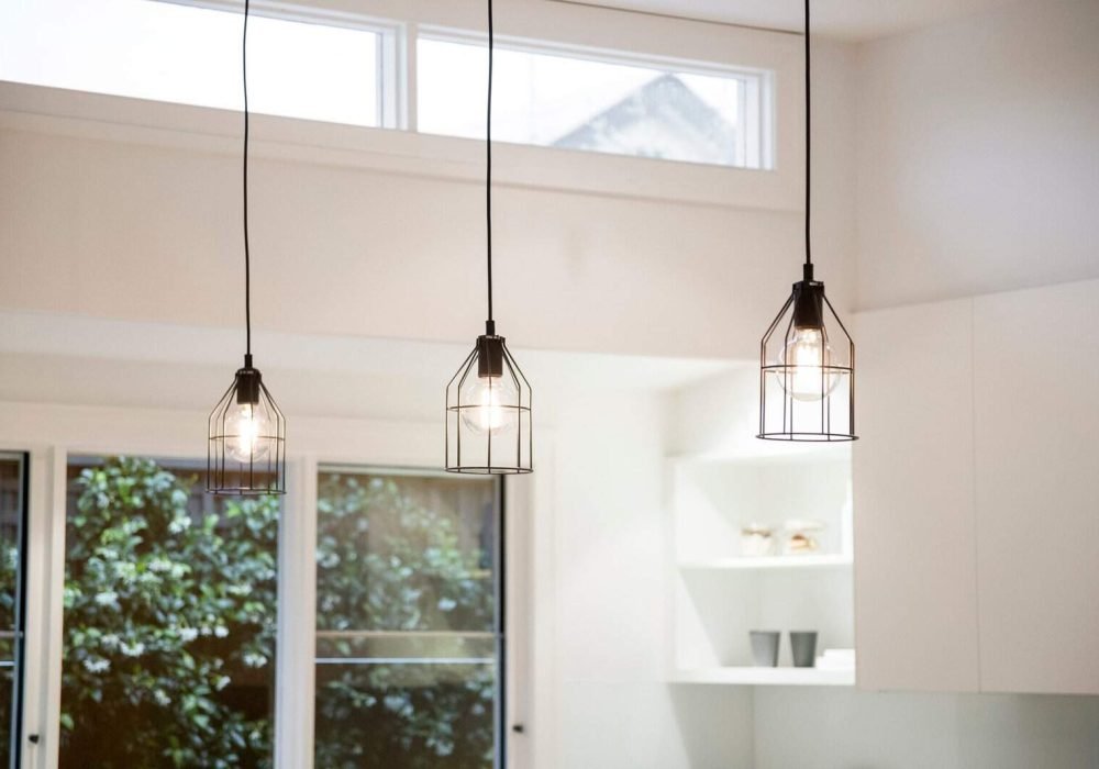 Pendant lighting fixtures in a contemporary kitchen setting.