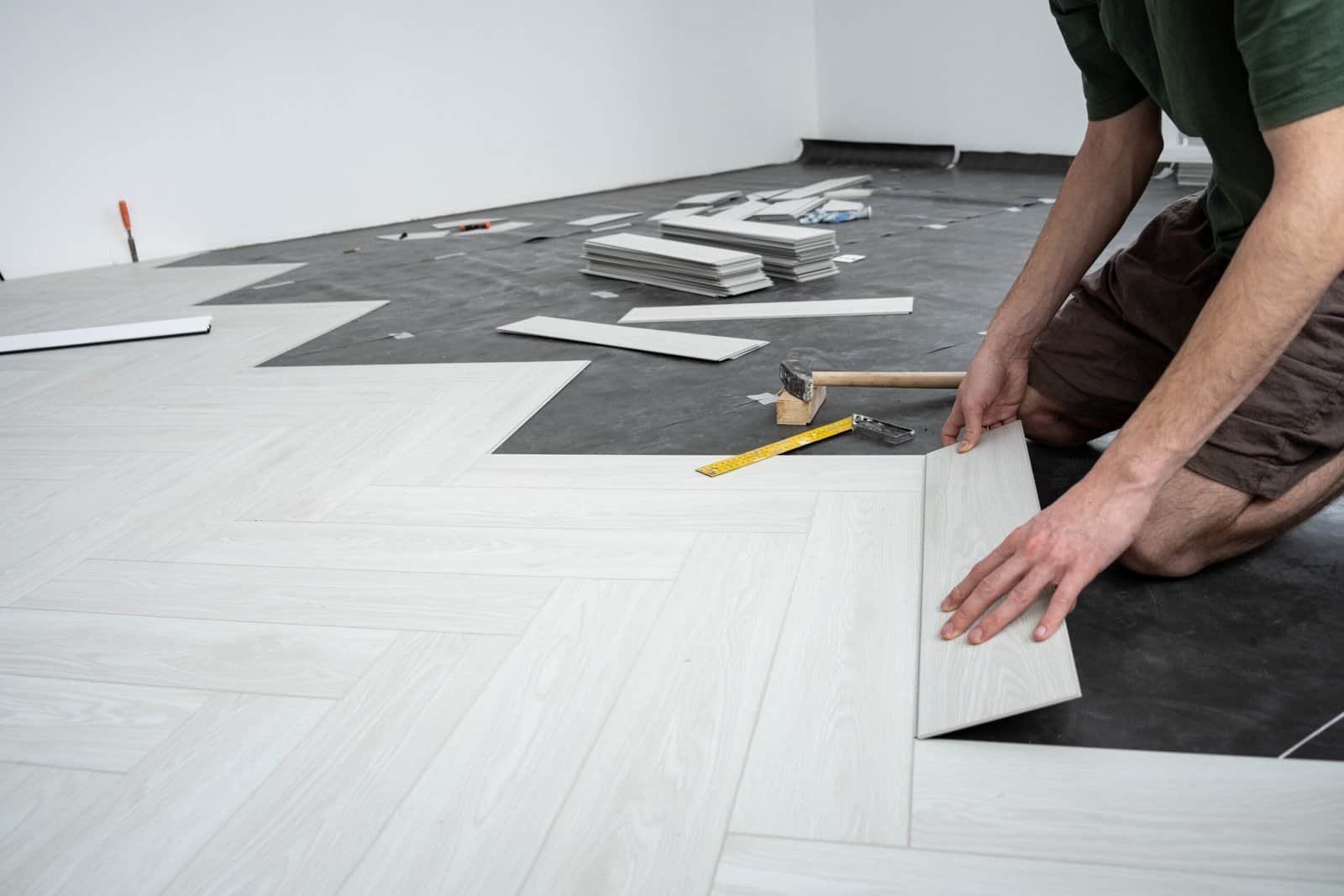 Flooring installation by R. Higuera's construction team.