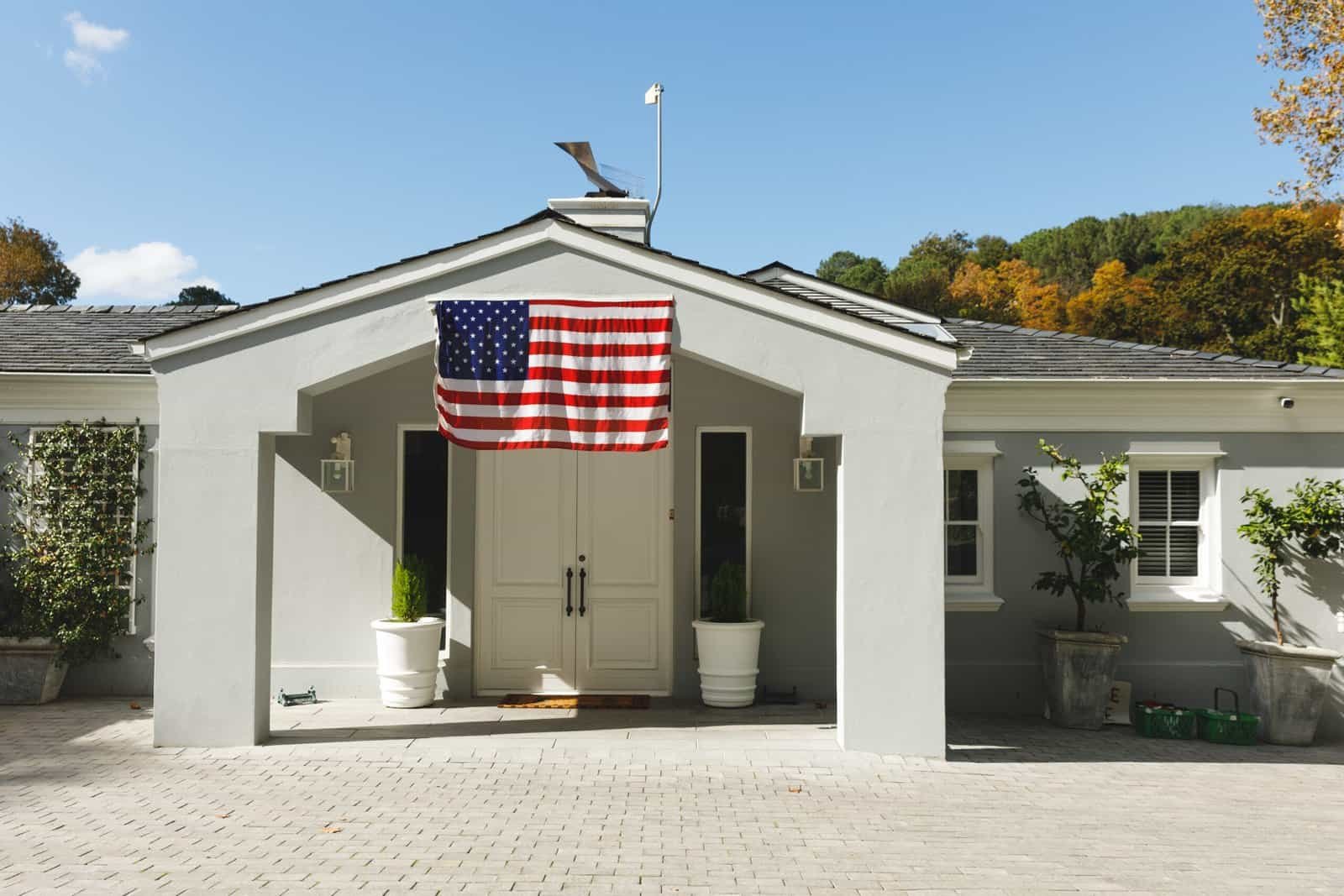 American flag at building entrance for construction project.