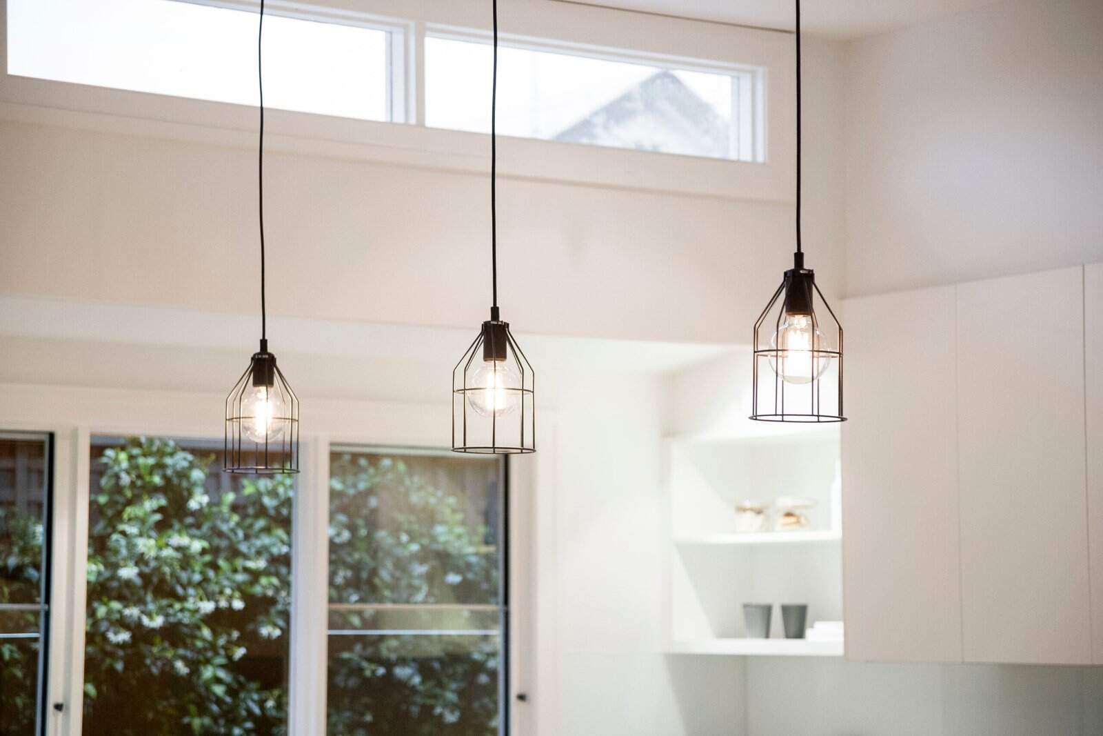 Pendant lighting fixtures in a contemporary kitchen setting.